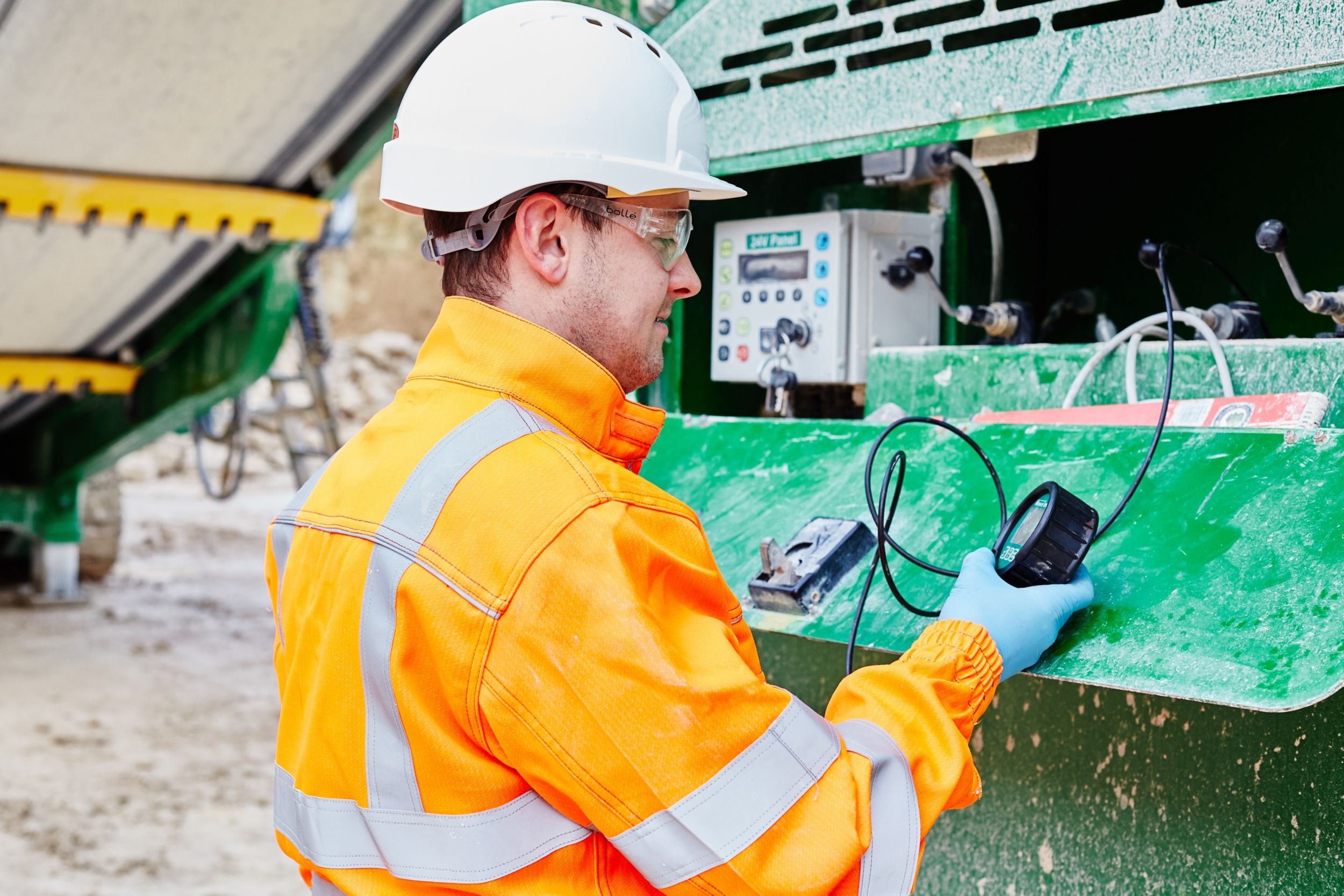 Man reading engine data from meter