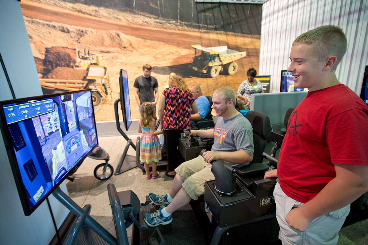 People gathered around monitor at field trip