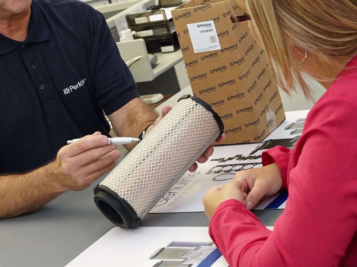 Distributor showing customer a filter