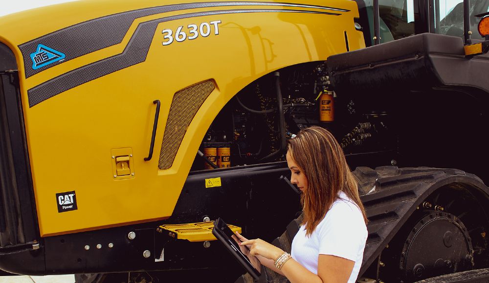 Woman with tablet connecting to MTS tractor Image 3