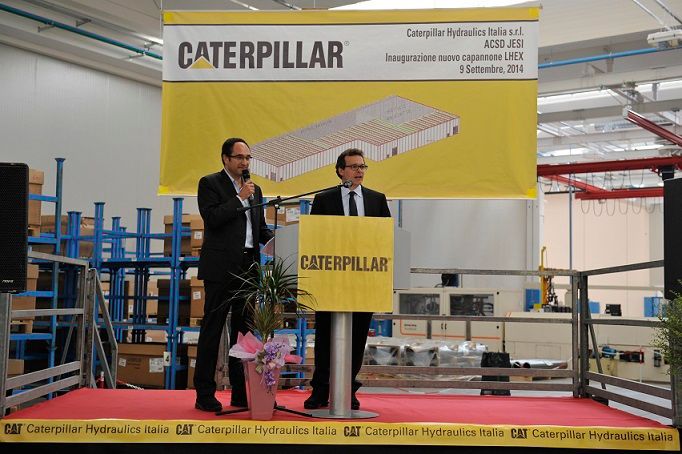 Two men at podium in Jesi facility