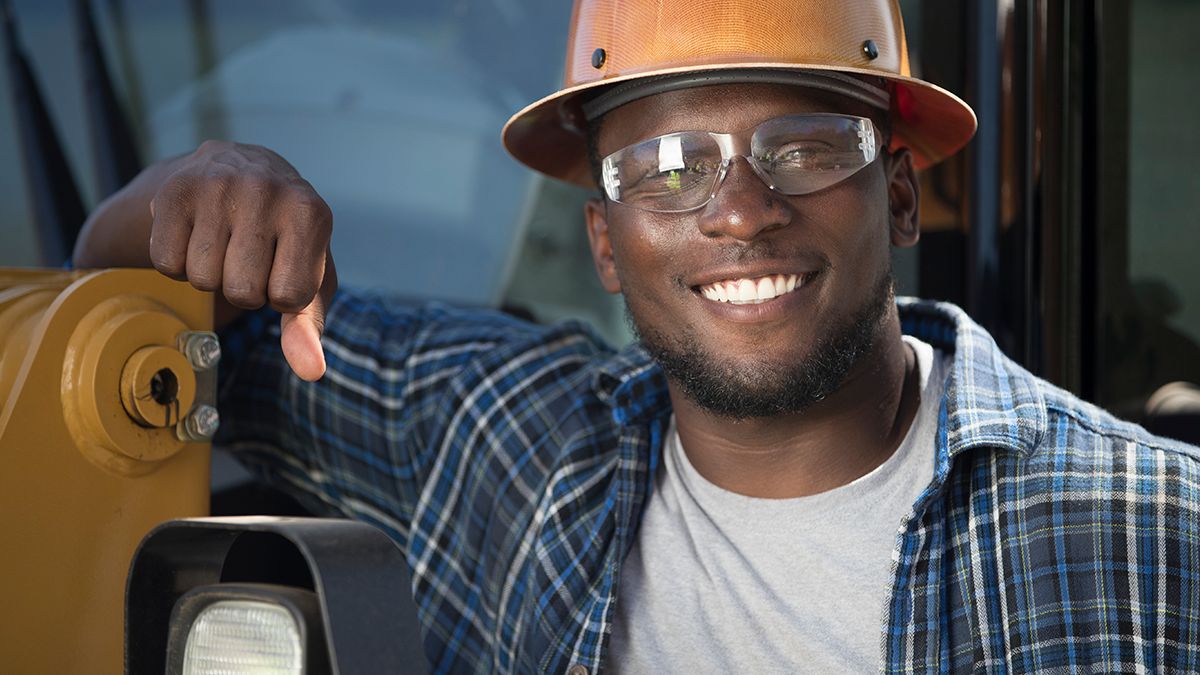 cat card in excavator bucket