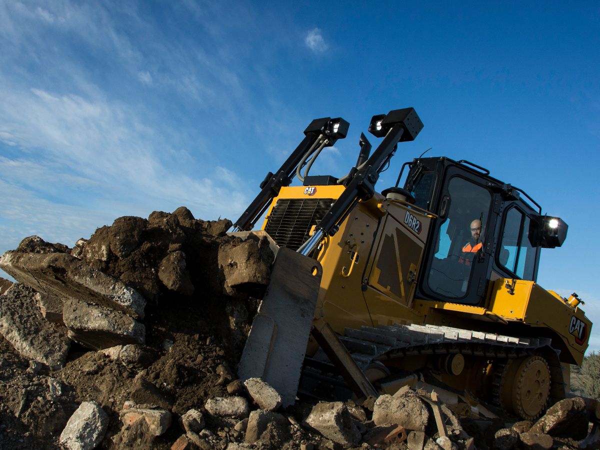 Cat D6R2 bulldozer pushing demolished concrete