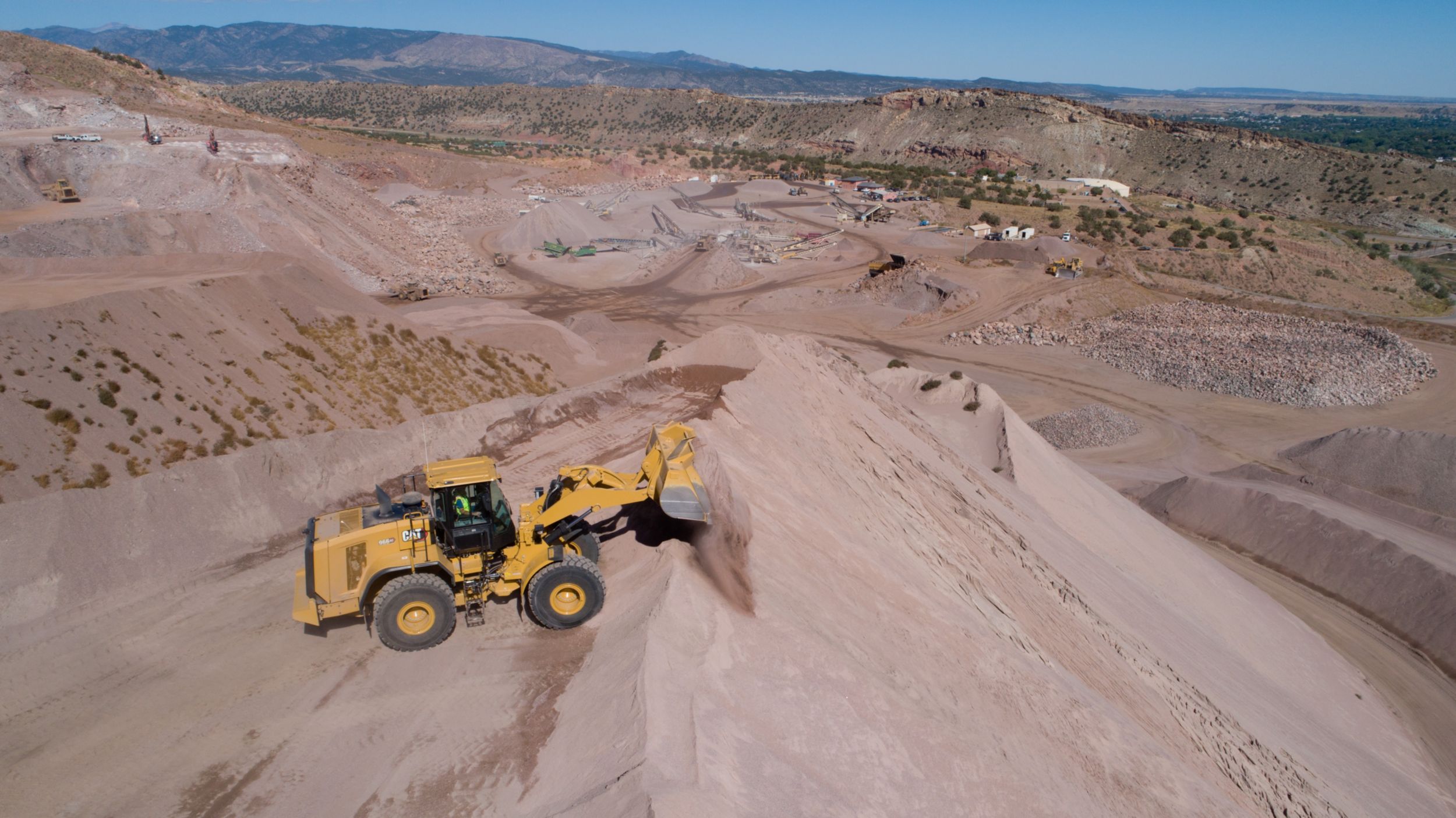 966 GC Medium Wheel Loader Scooping Dirt