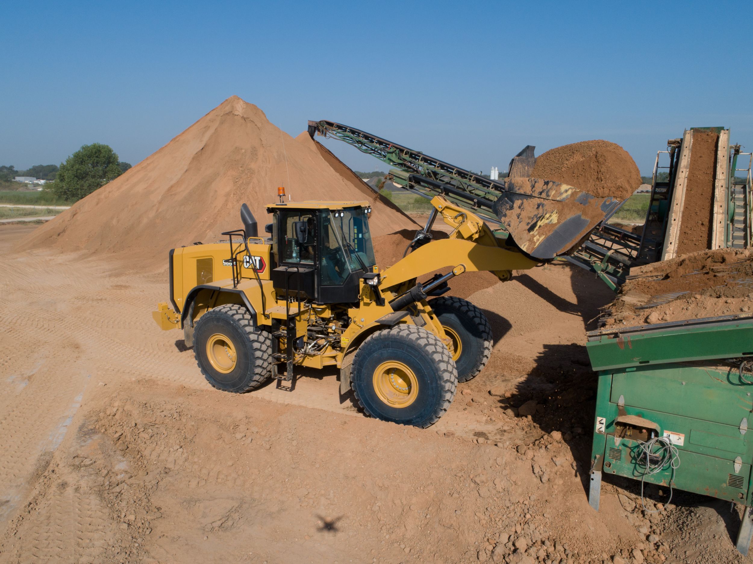 966 GC Medium Wheel Loader with a Full Bucket