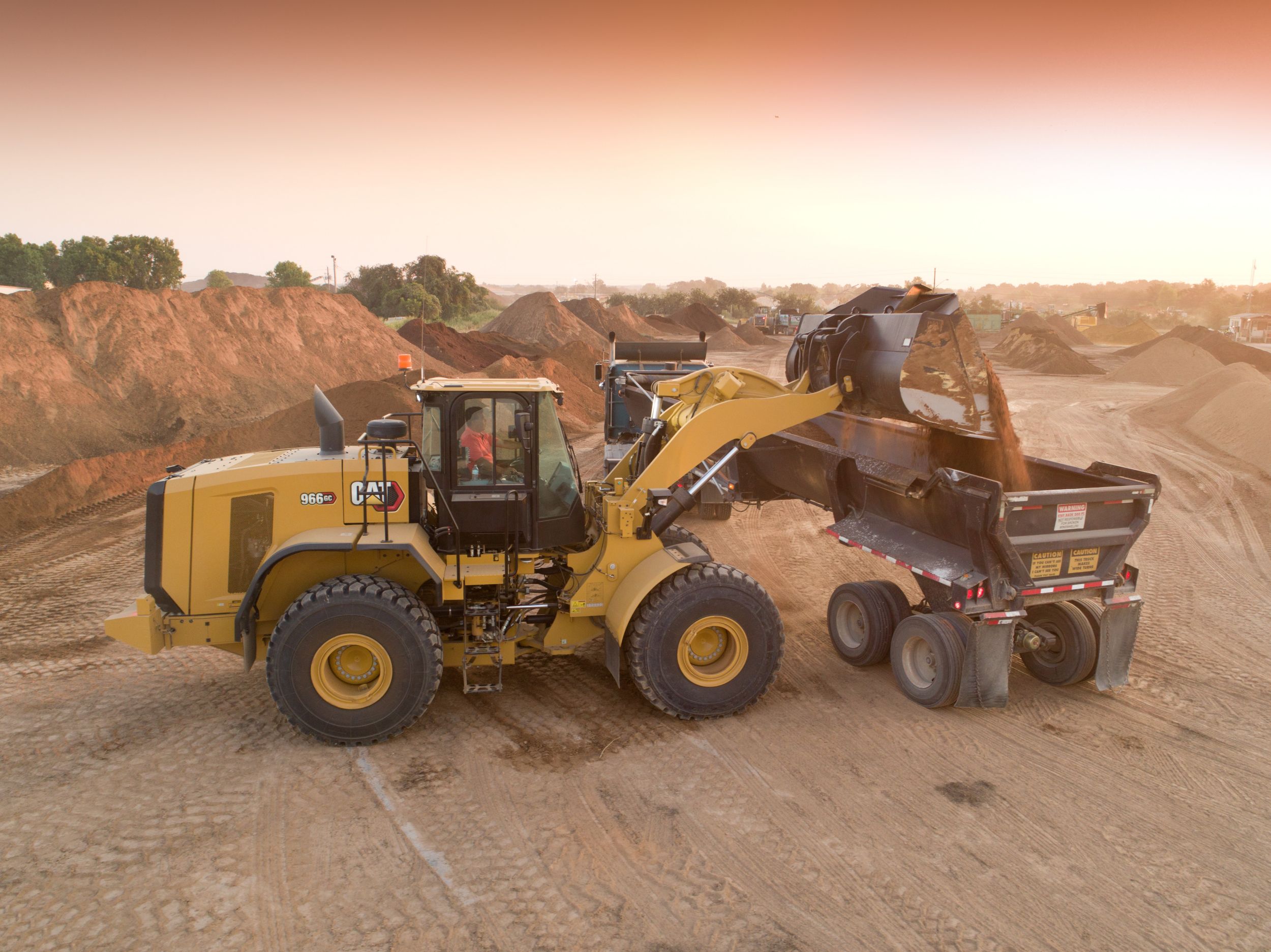 966 GC Medium Wheel Loader Loading a Truck