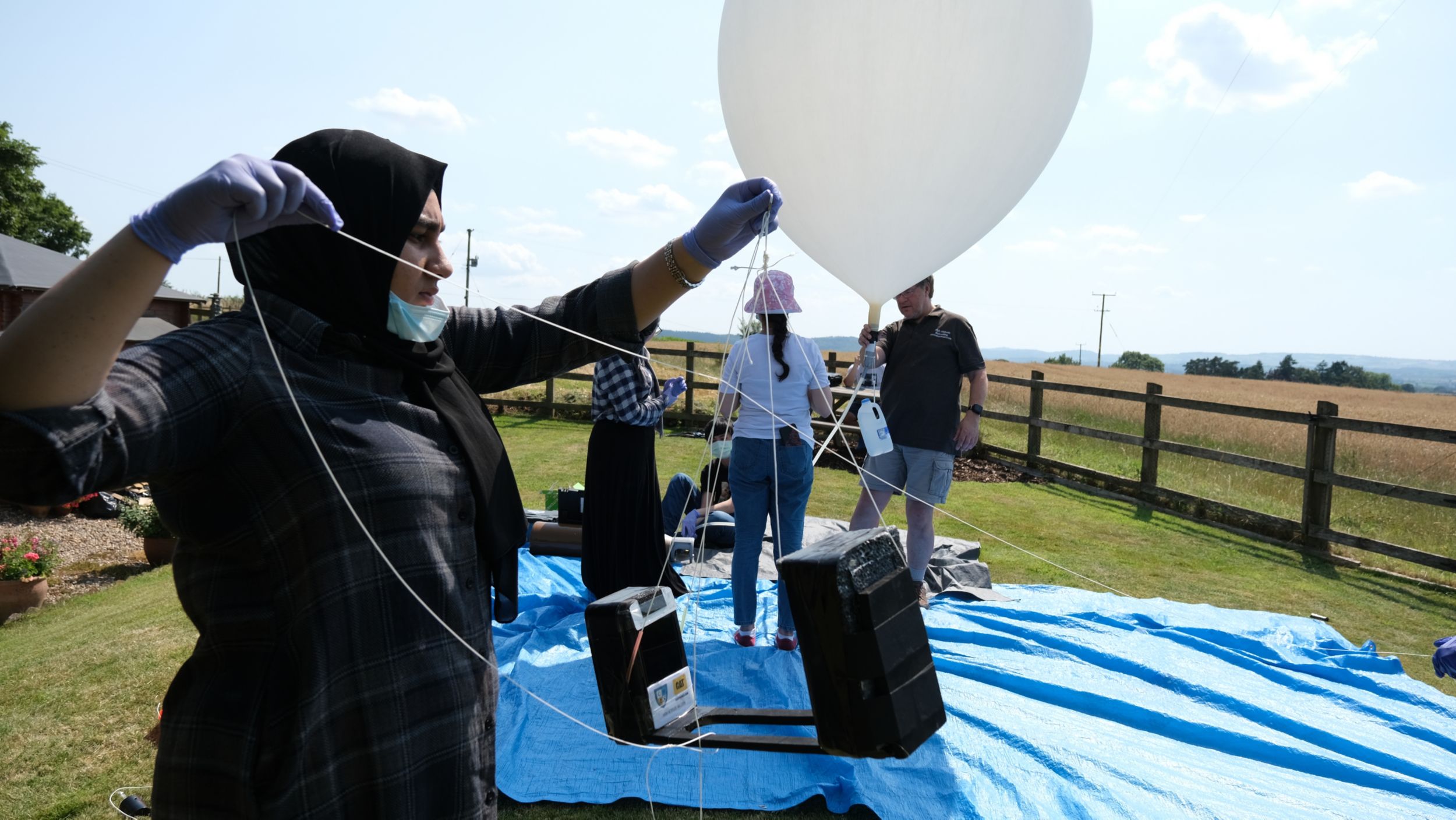 The students attached two Cat S62 Pro phones to a balloon with the phones facing one another.