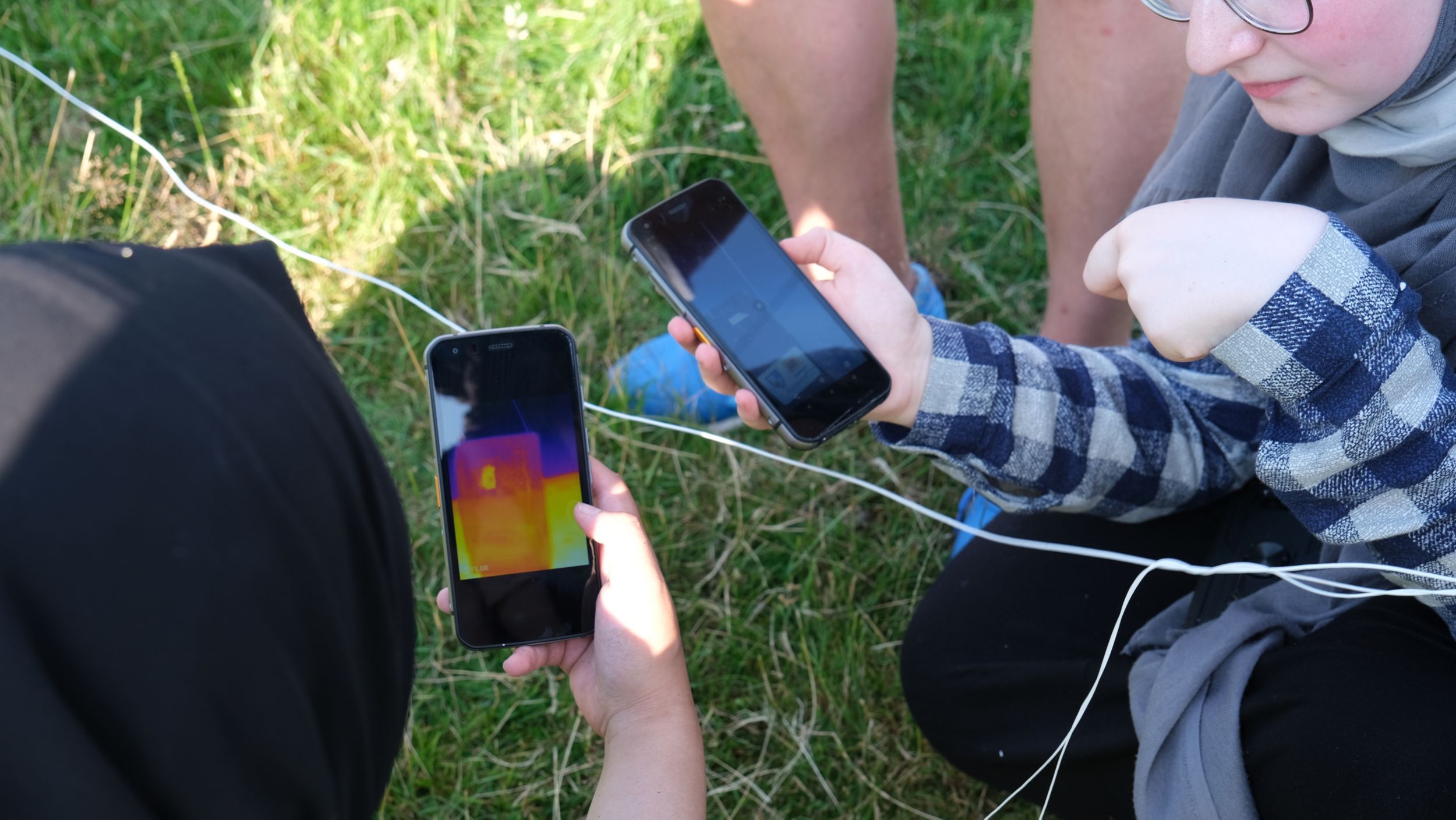 One phone recorded a standard video while the other captured thermal images to document the extreme temperatures. 