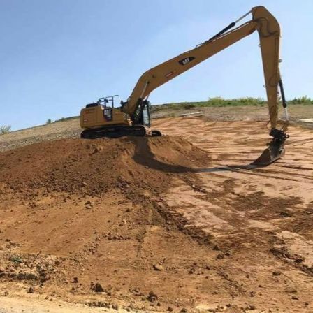 Excavator working on airport expansion in Philippines