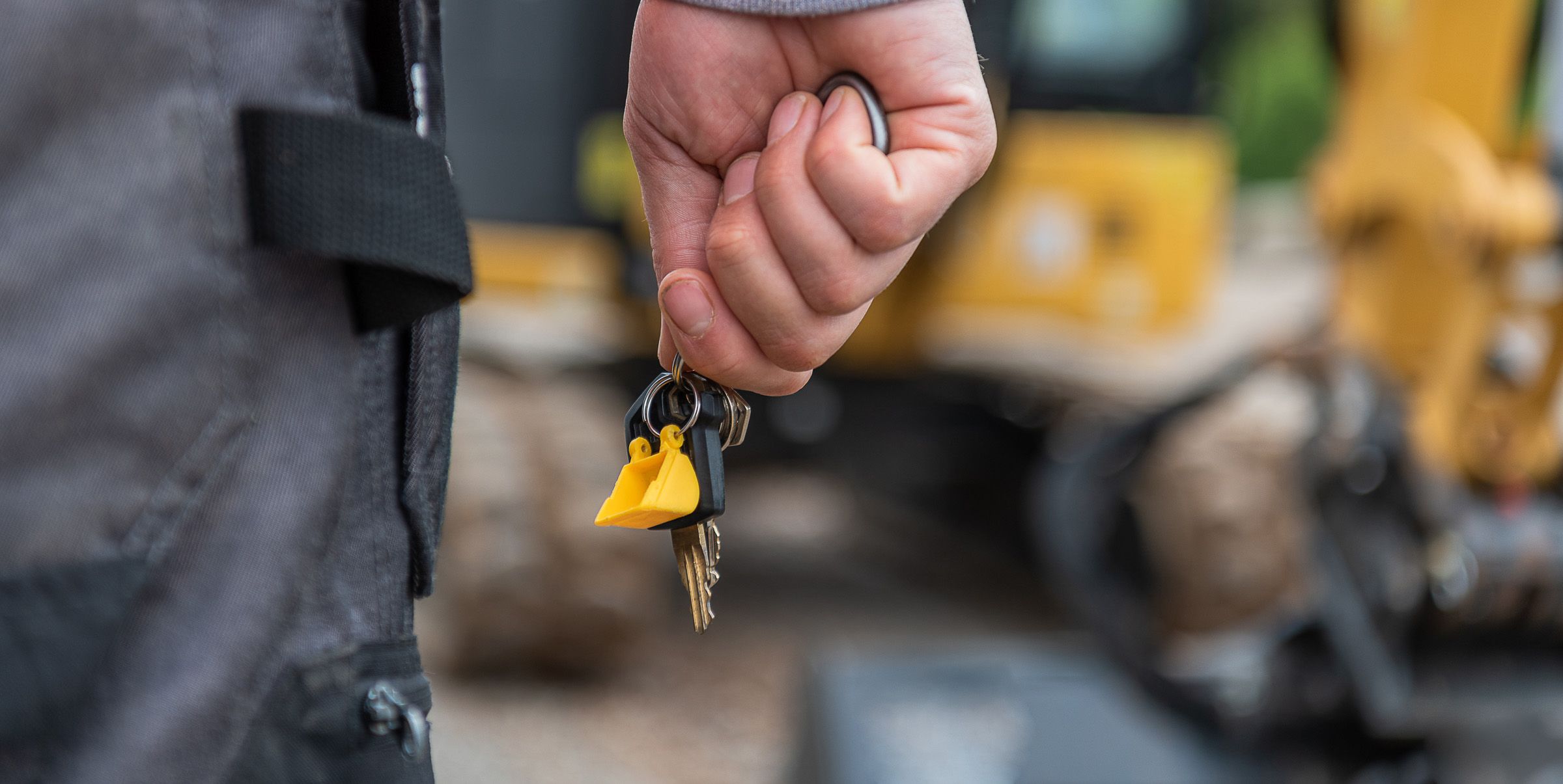 Operator holding keys to Cat machine