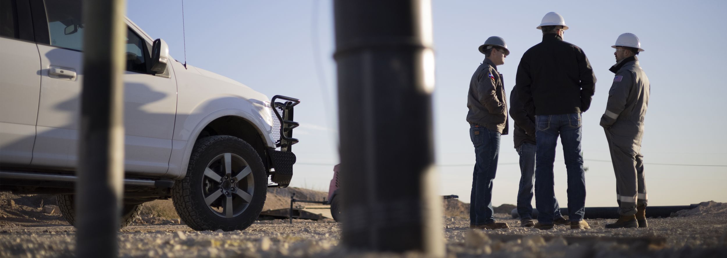 3 Men Near Truck at worksite