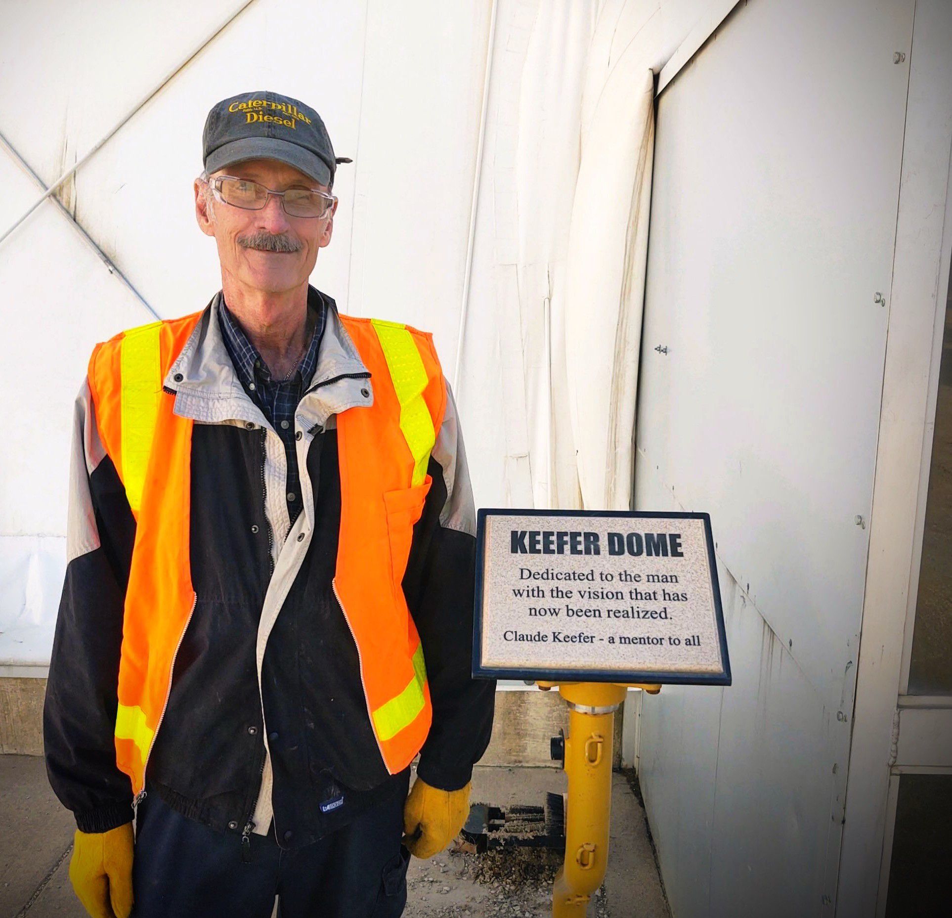 man standing in front of Keefer Dome