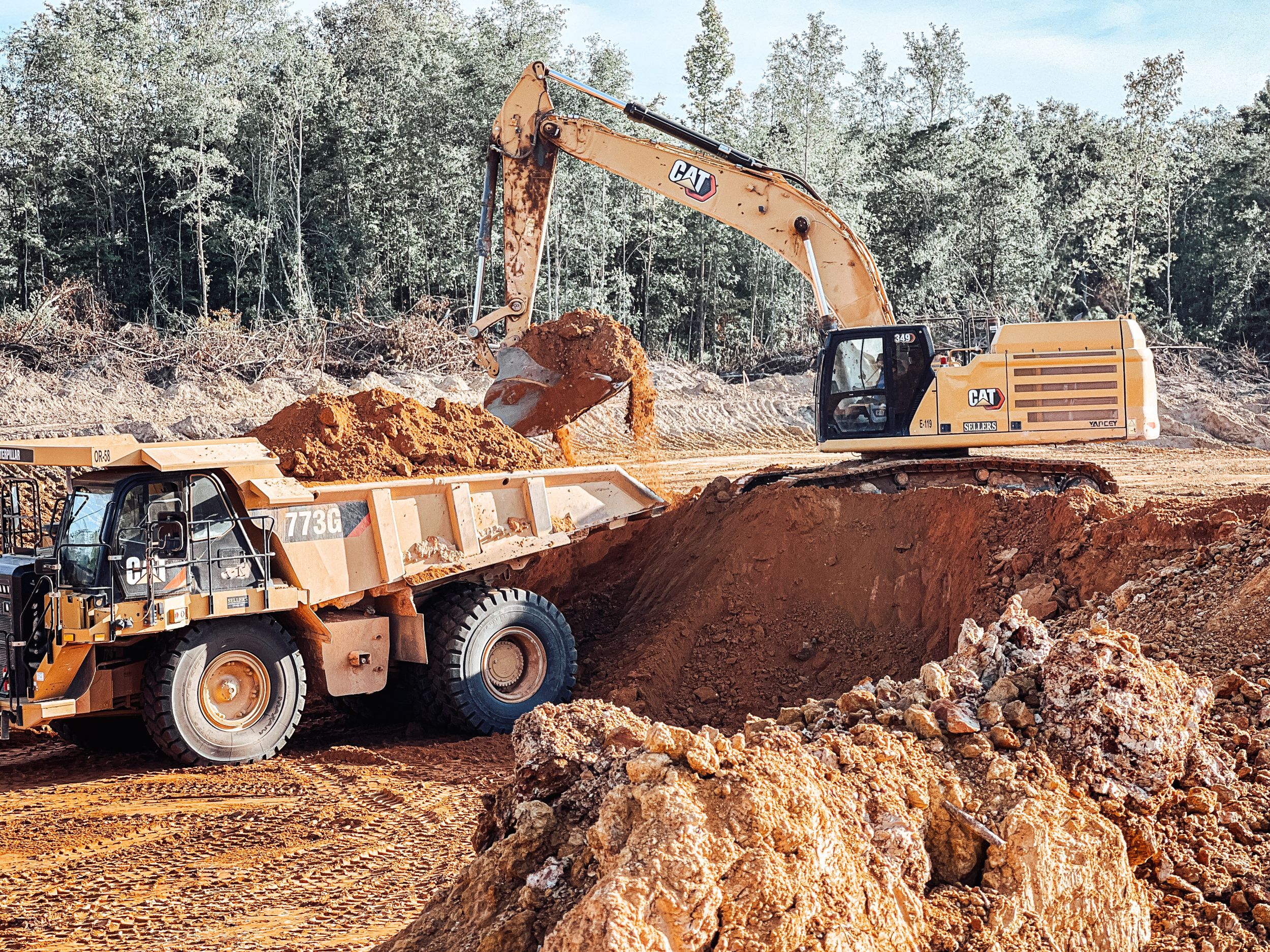 Equipment working on jobsite near dusk