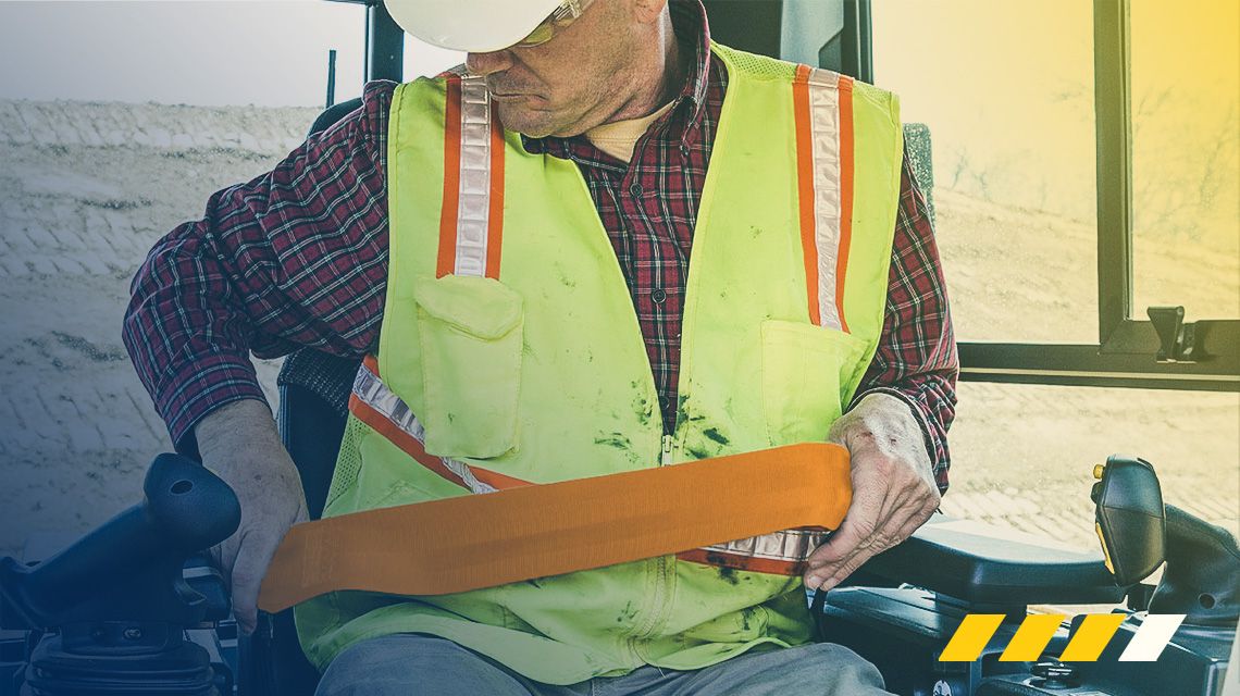 Operator buckling his seat belt