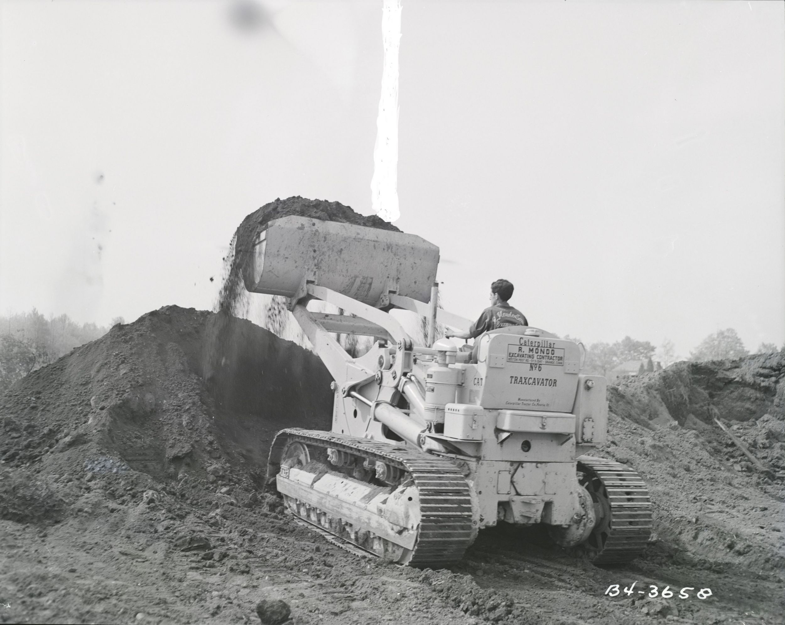 The Caterpillar No. 6 Traxcavator pushing dirt 