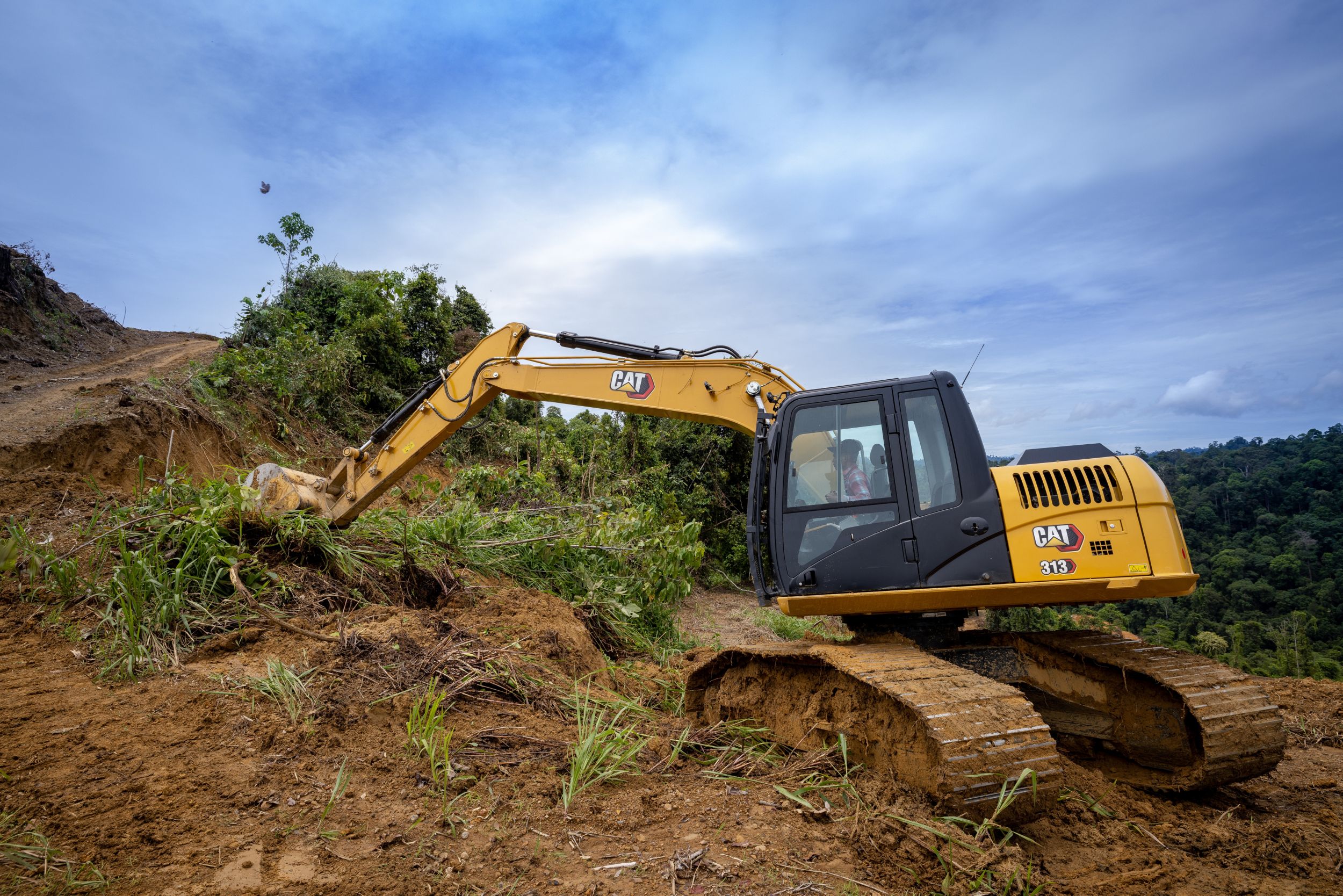 Cat 313 low ground pressure hydraulic trackhoe excavator brings premium power, performance, control, digging, trenching, and heavy lifting capability to your large scale projects.