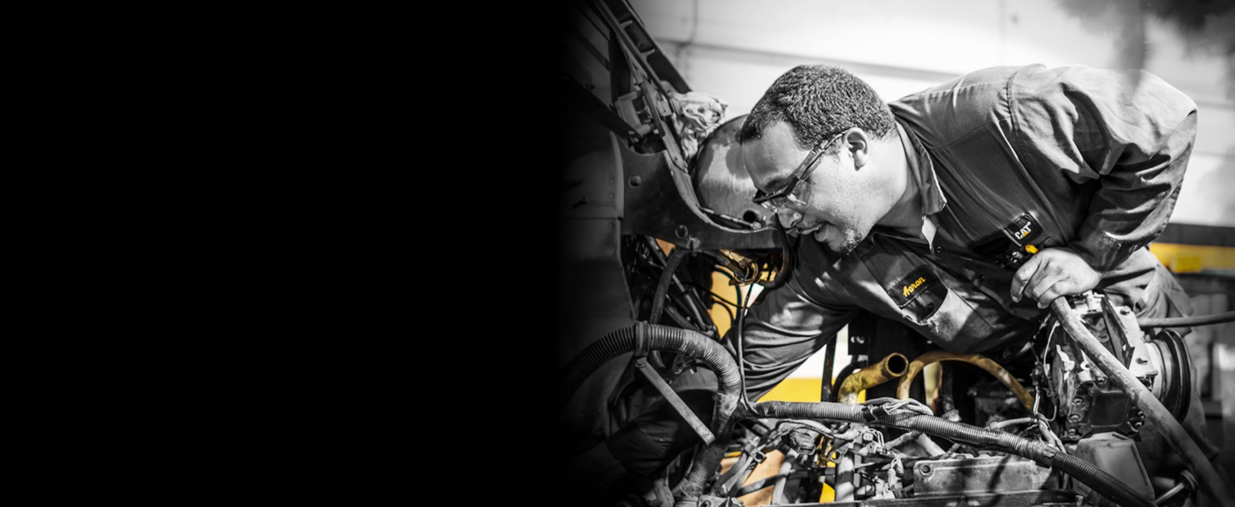 Man servicing engine parts