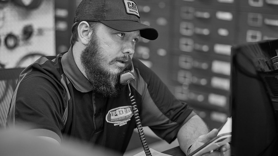 Technician using telephone