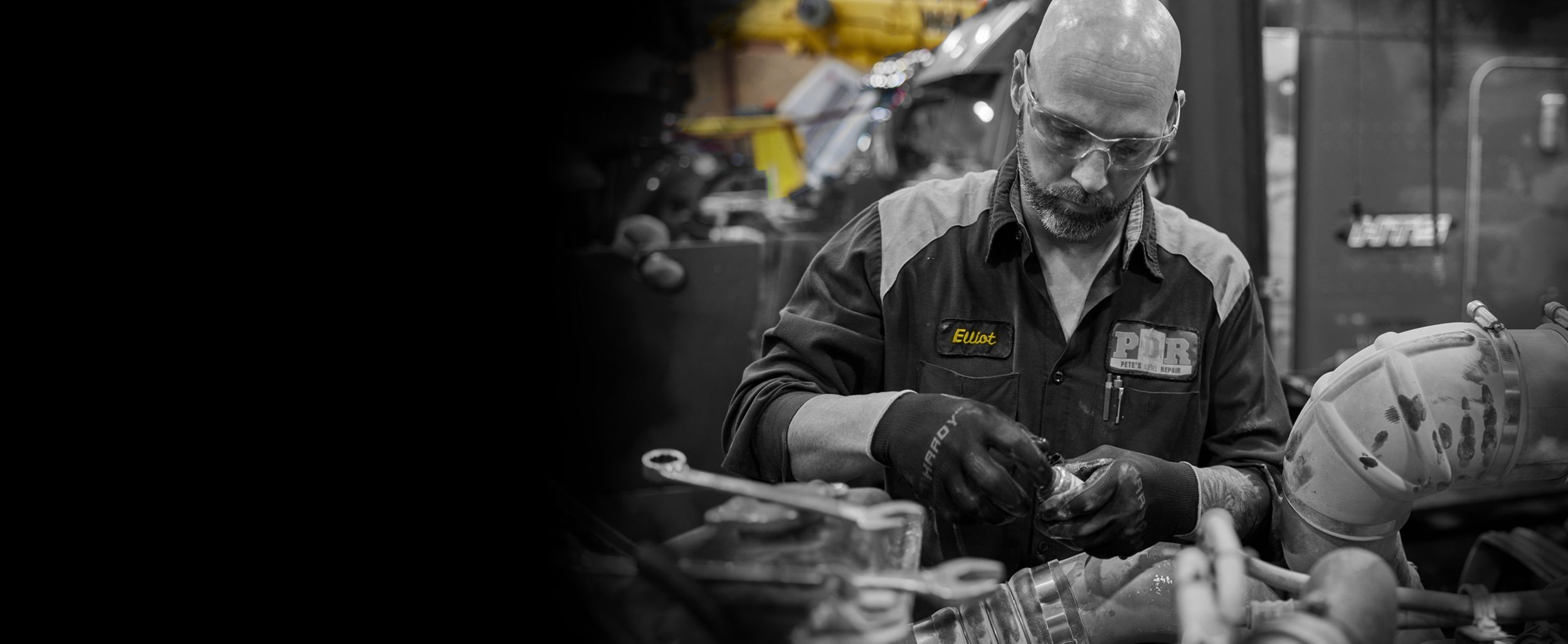 tech servicing engine parts