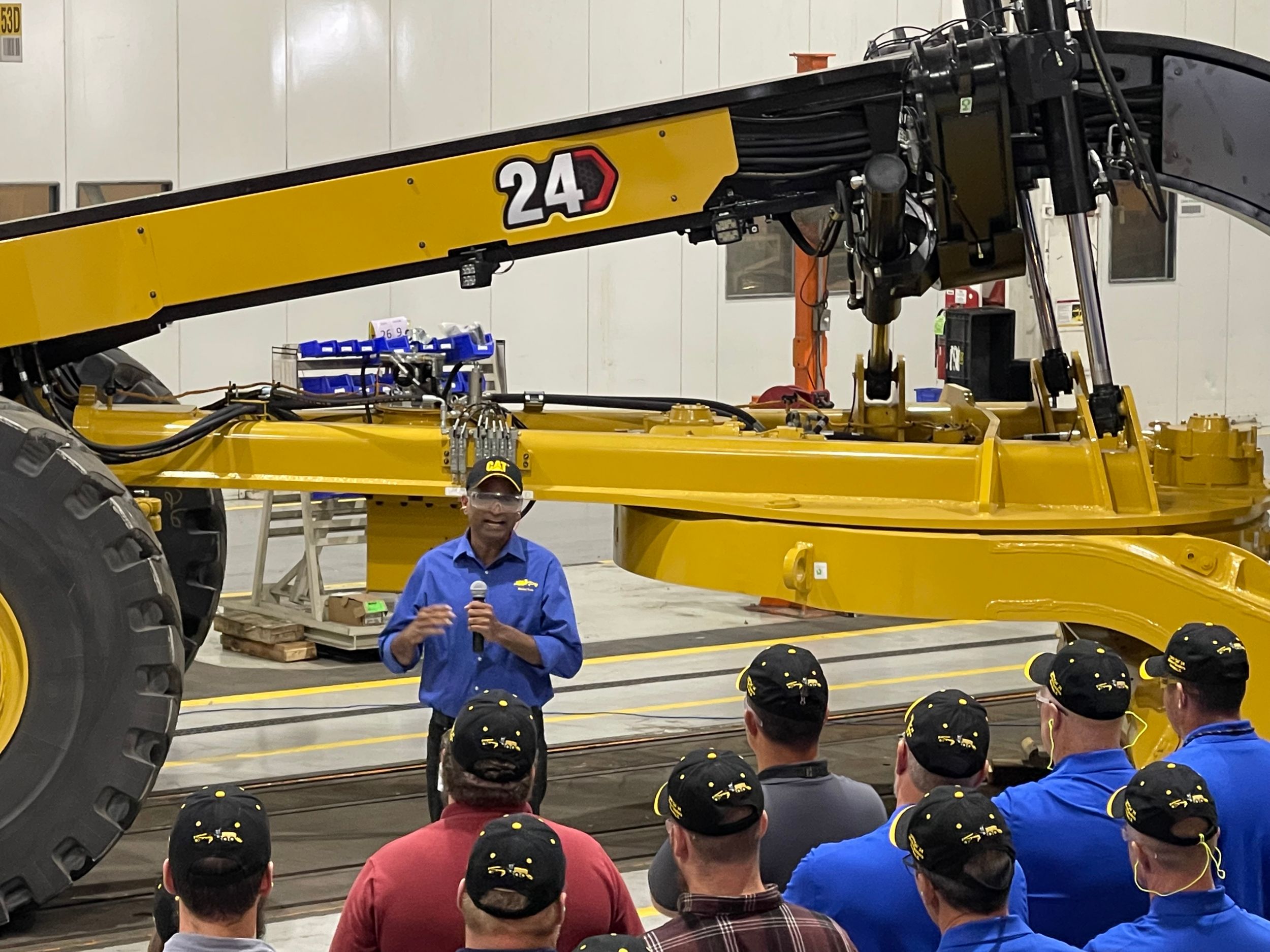 Leader delivering remarks at the 1000th 24 Motor Grader celebration 