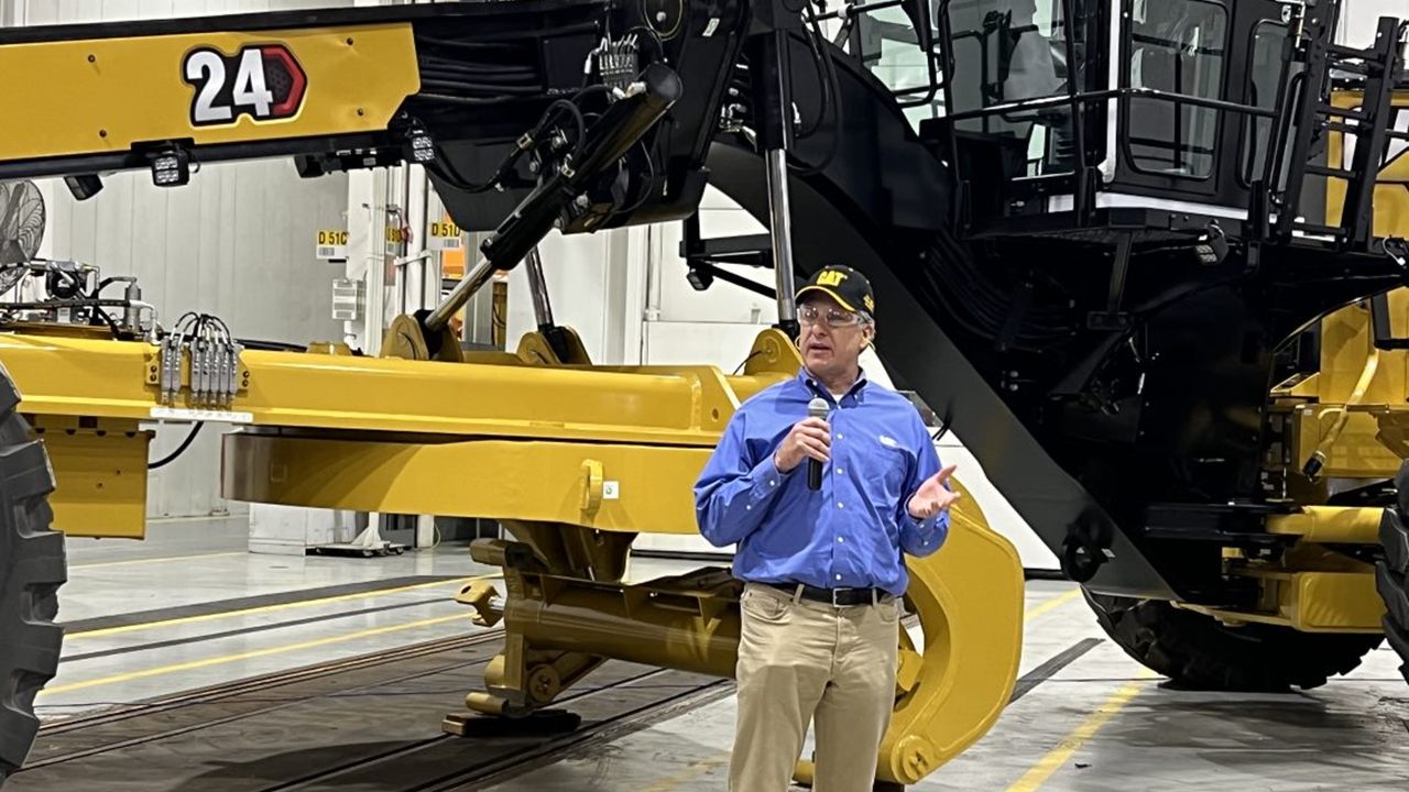 Man standing speaking to a crowd