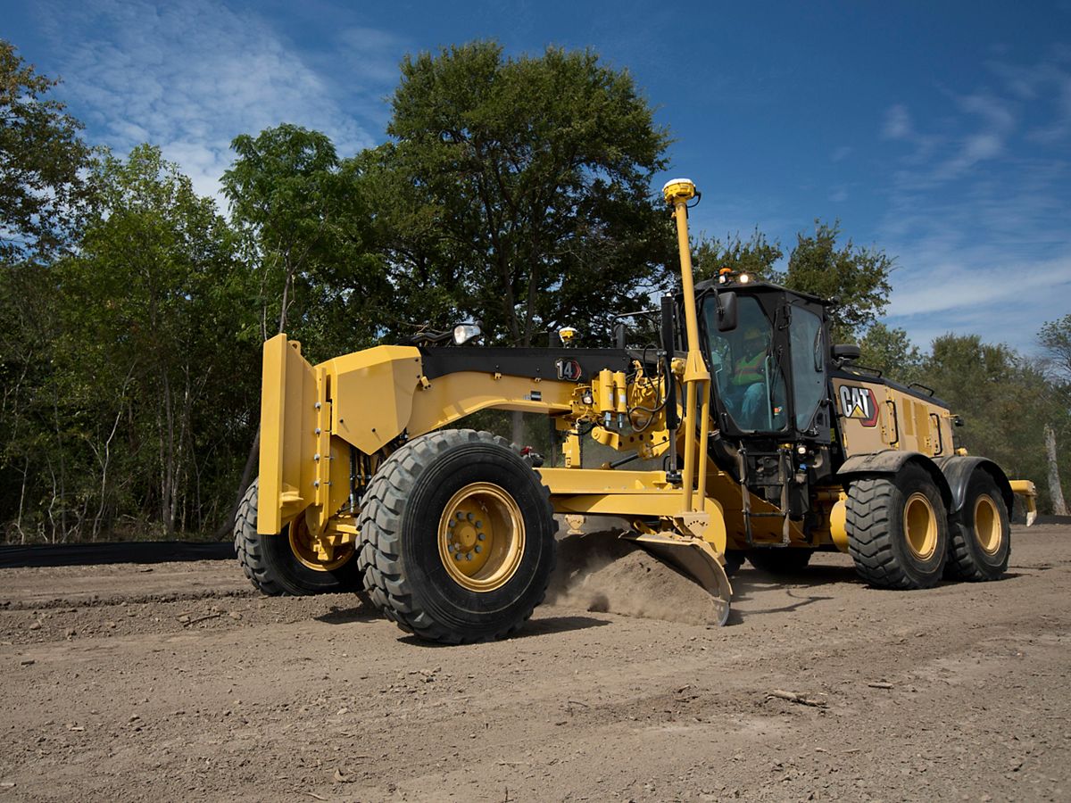 14 Motor Grader pushing gravel