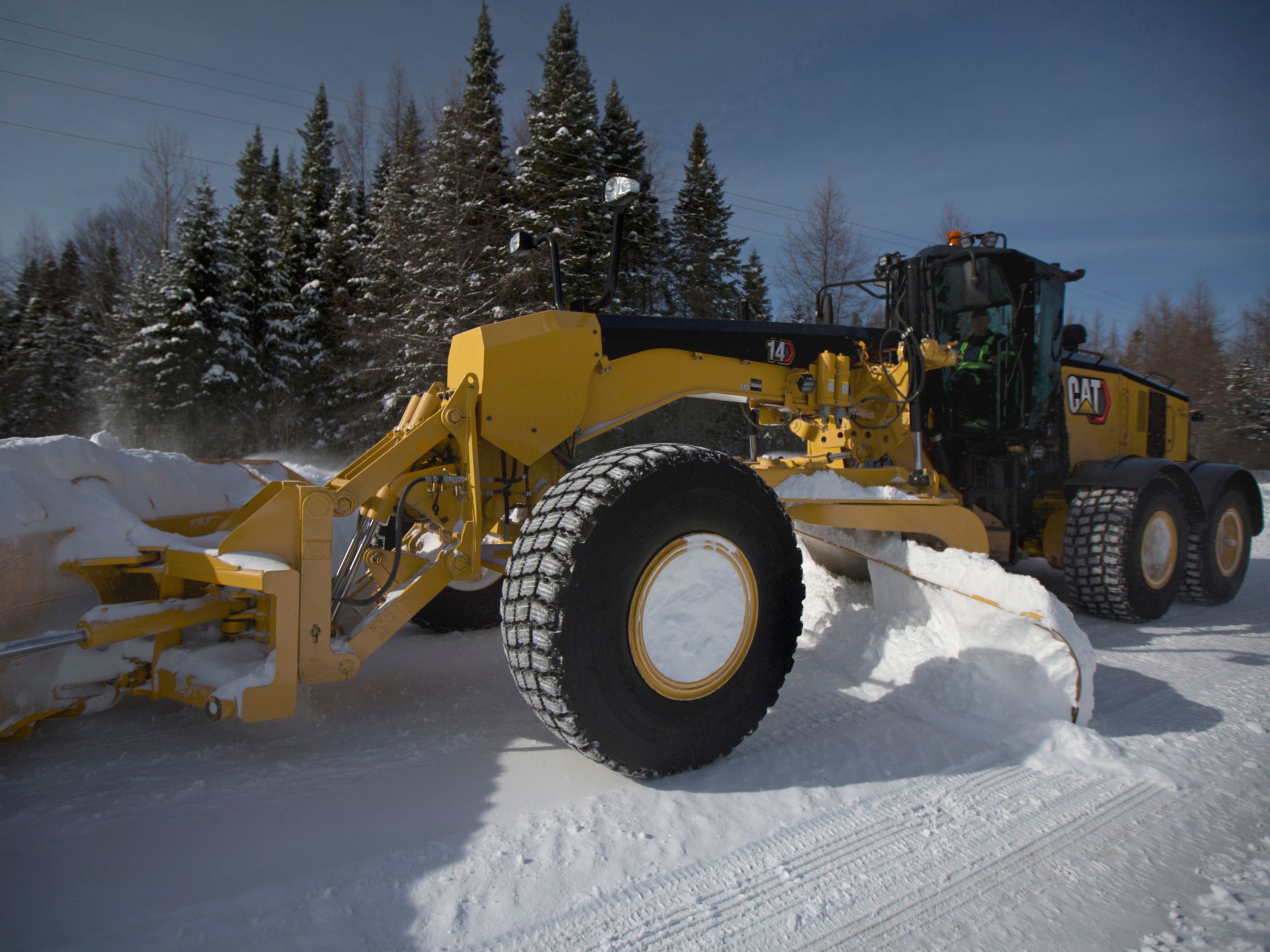 14 Motor Grader pushing snow with snow blade