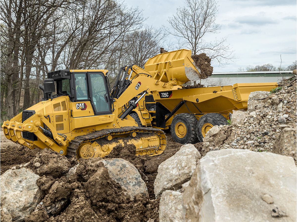The 973 crawler loader is powerful enough for heavy truck loading