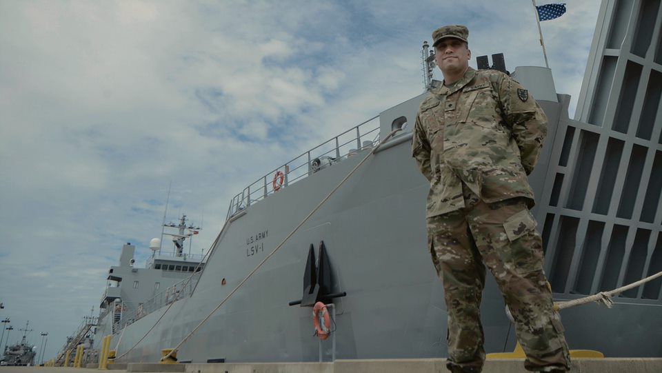 Soldier in front of a ship