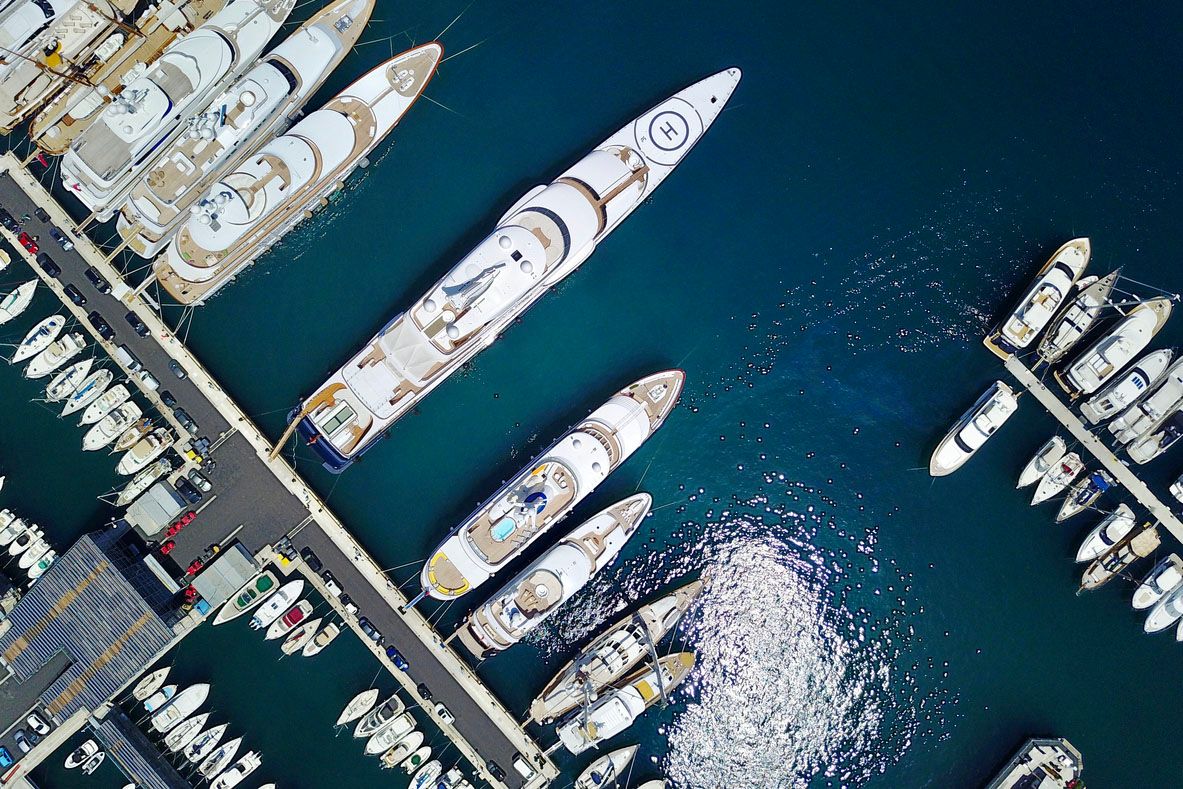 Aerial view of different sized yachts and boats at berth in a marina