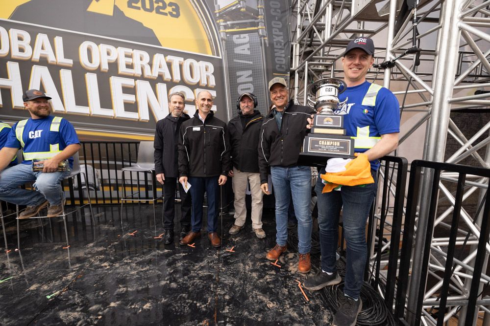 Global Operator Challenge winner celebrates with his trophy. 
