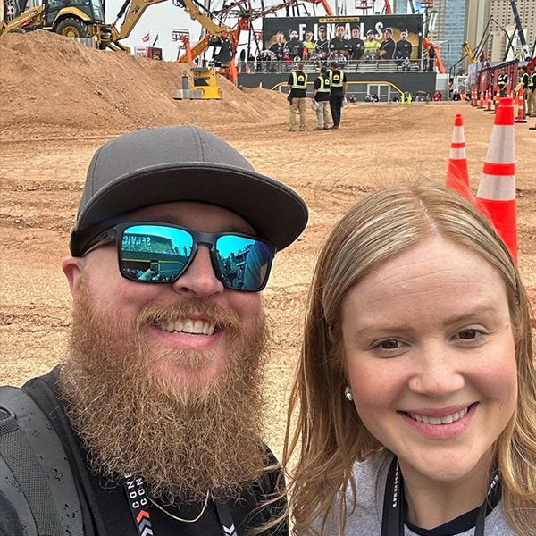 two show attendees pose as the operator challenge gets started