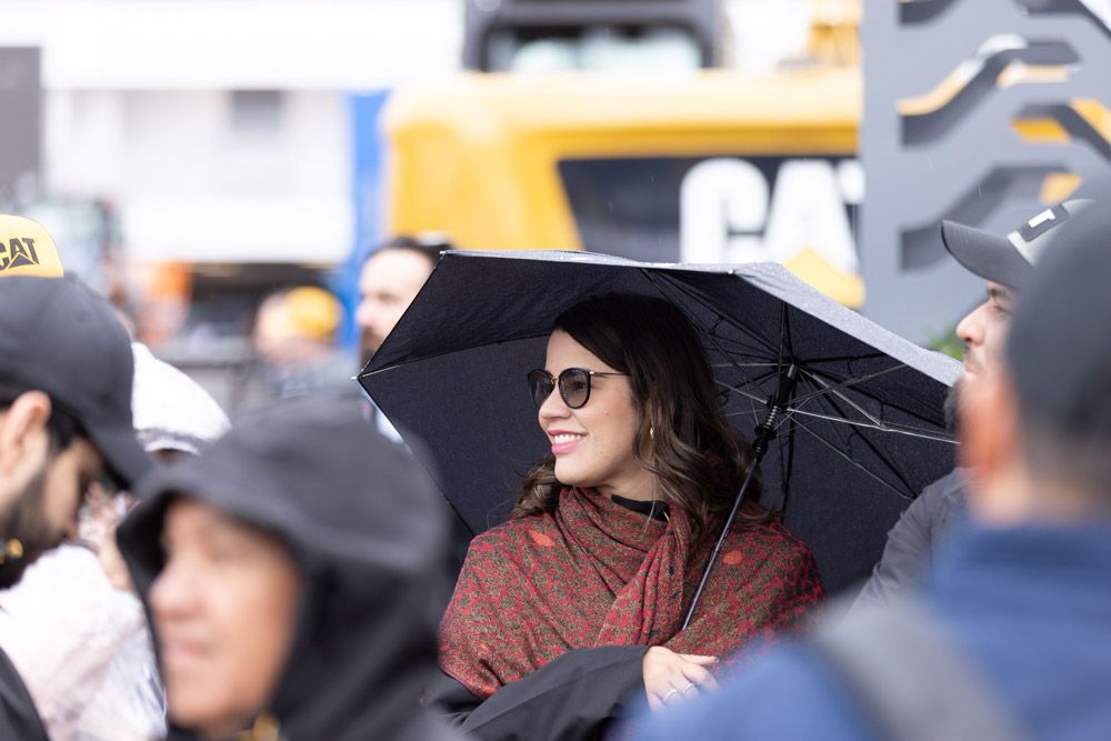 Woman holds an umbrella in the rain