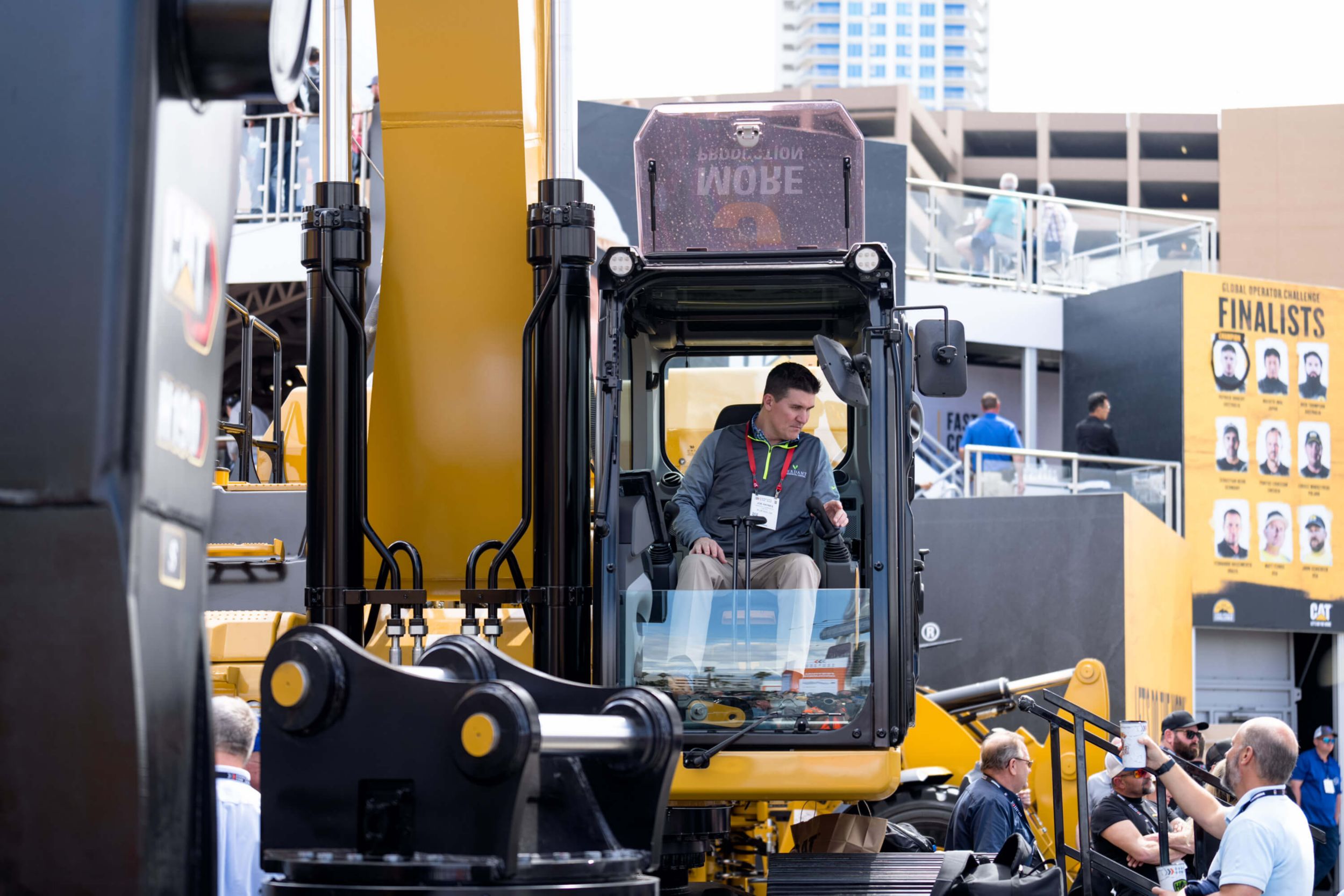 Attendee sits in the cab of an excavator