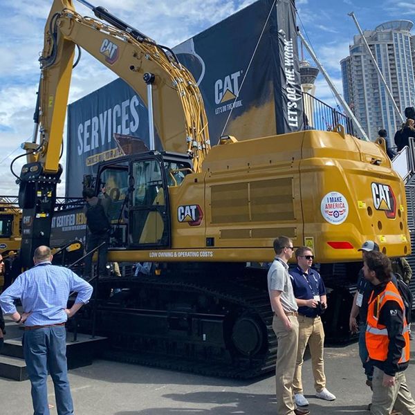 Cat excavator positioned outside the Services Hub at ConExpo 2023
