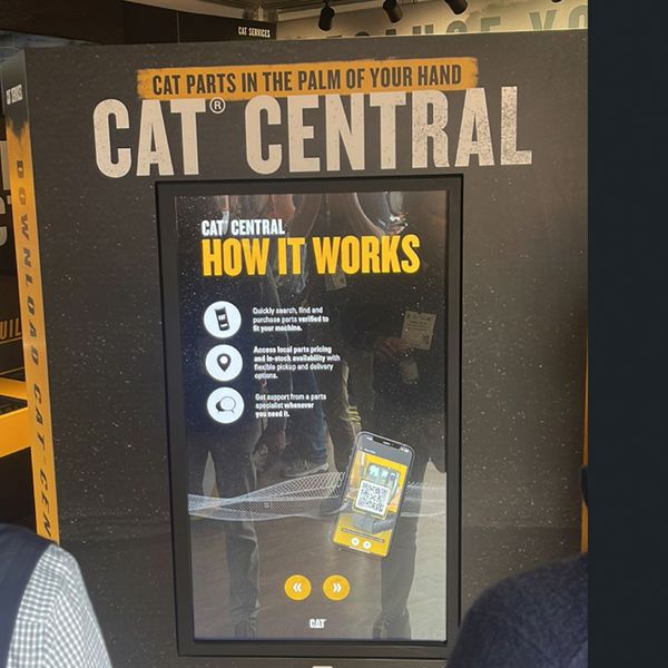 Cat Central touchscreen display inside the services booth at ConExpo 2023