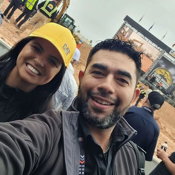 ConExpo attendees enjoy a photo opp outside Operator Stadium