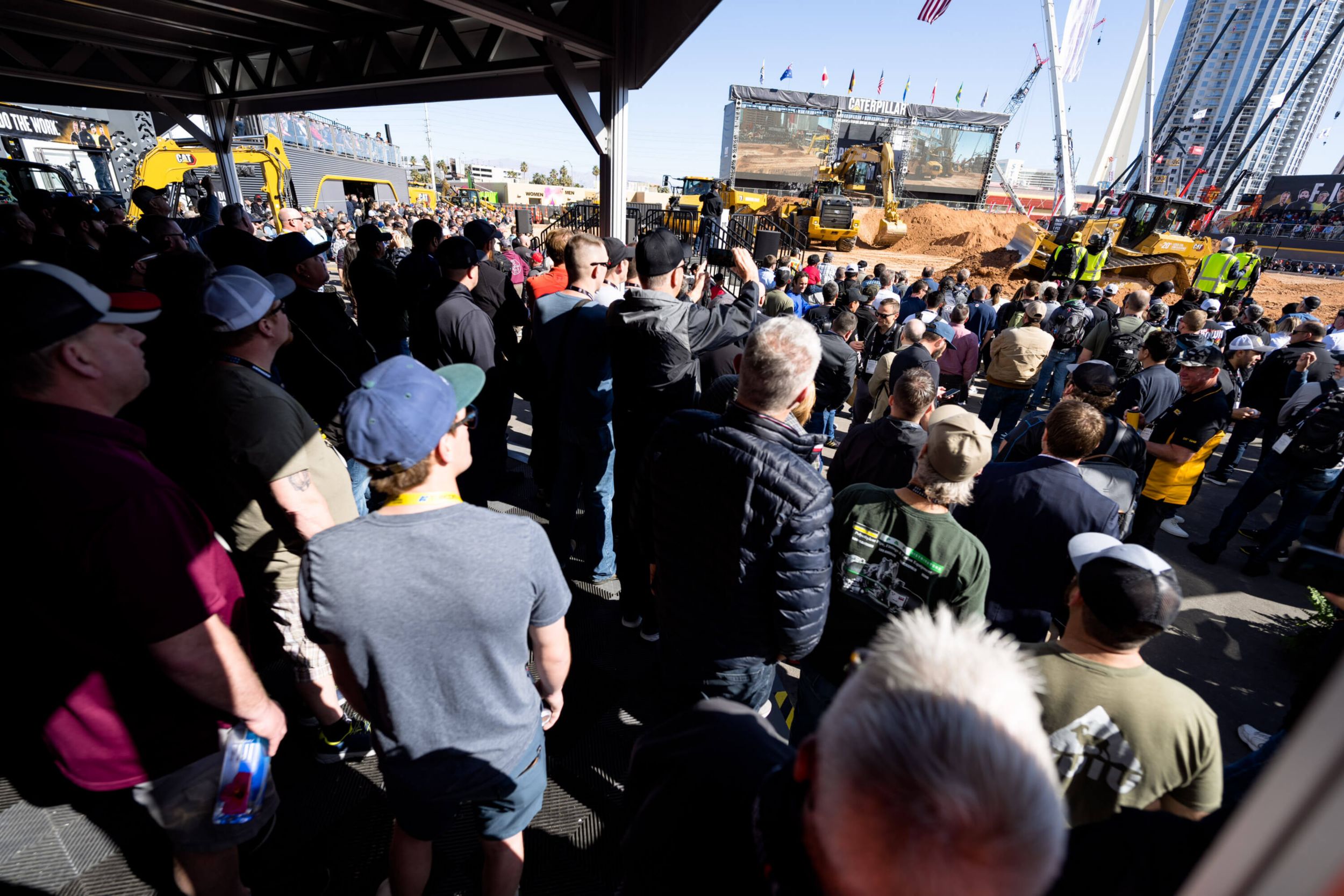 A crowd watches a demo