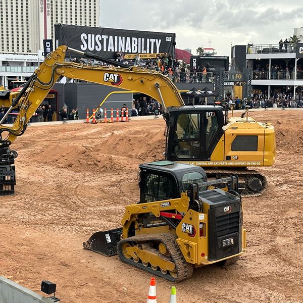 Cat excavator and compact track loader take to the dirt for a live demo at Operator Stadium