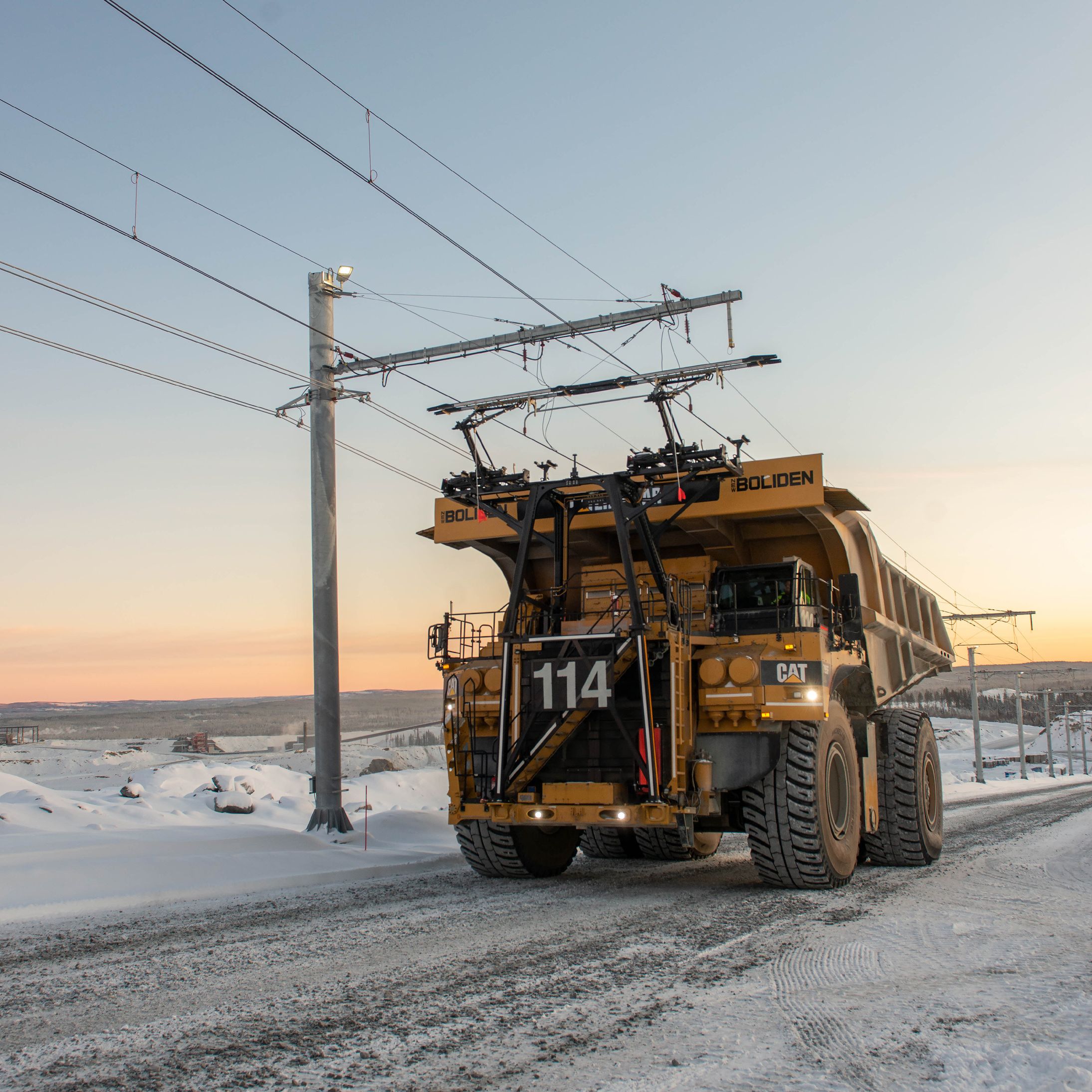 Cat 795 AC mining truck on trolley assist