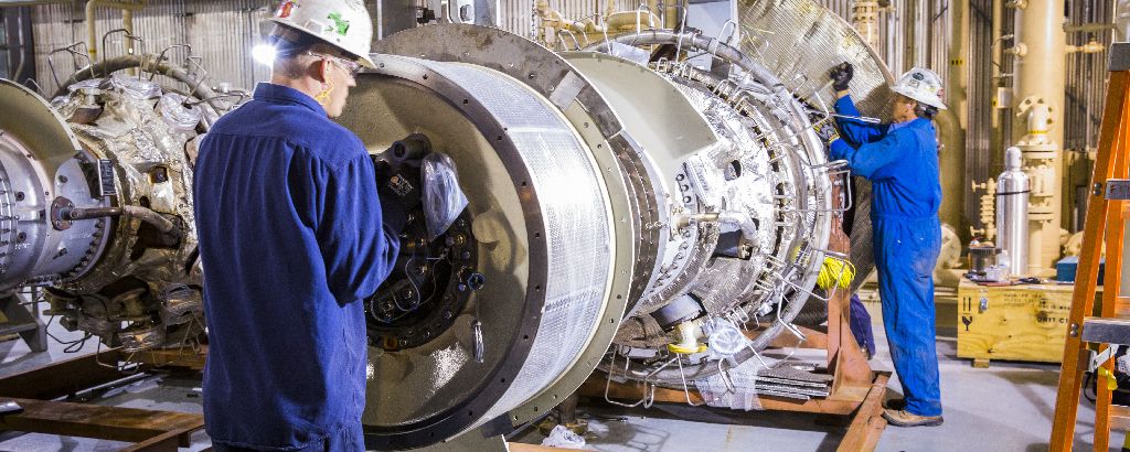 Men working on an engine