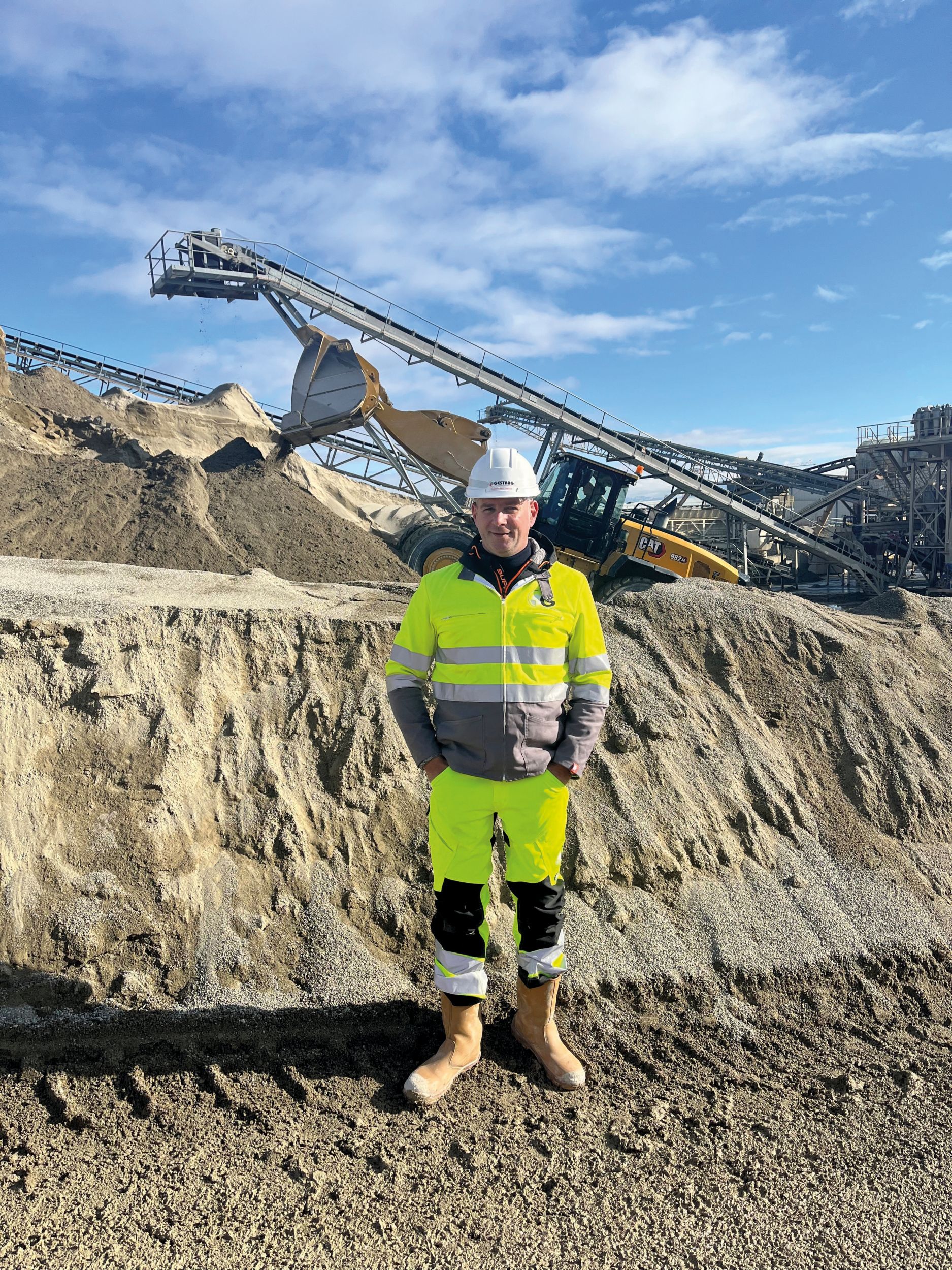 David Suppliciau, chief of projects for GESA’s parent company, Gestrag, with the Cat 982 XE at work behind him