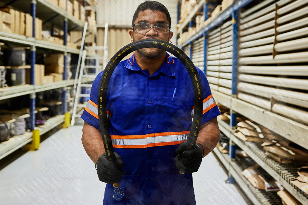 Dealer holds a Cat Hose