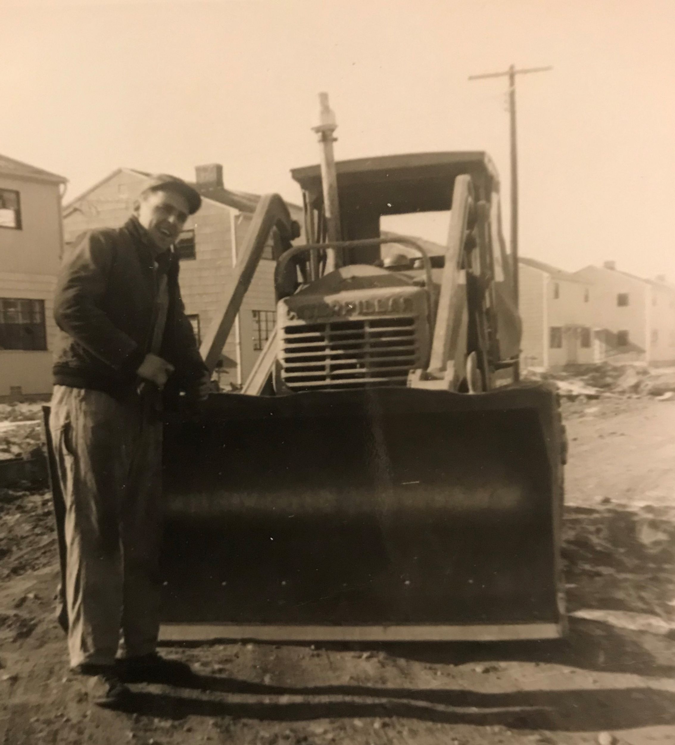 vintage photo man with track loader 