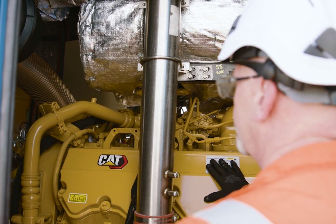 One man looking at a machine