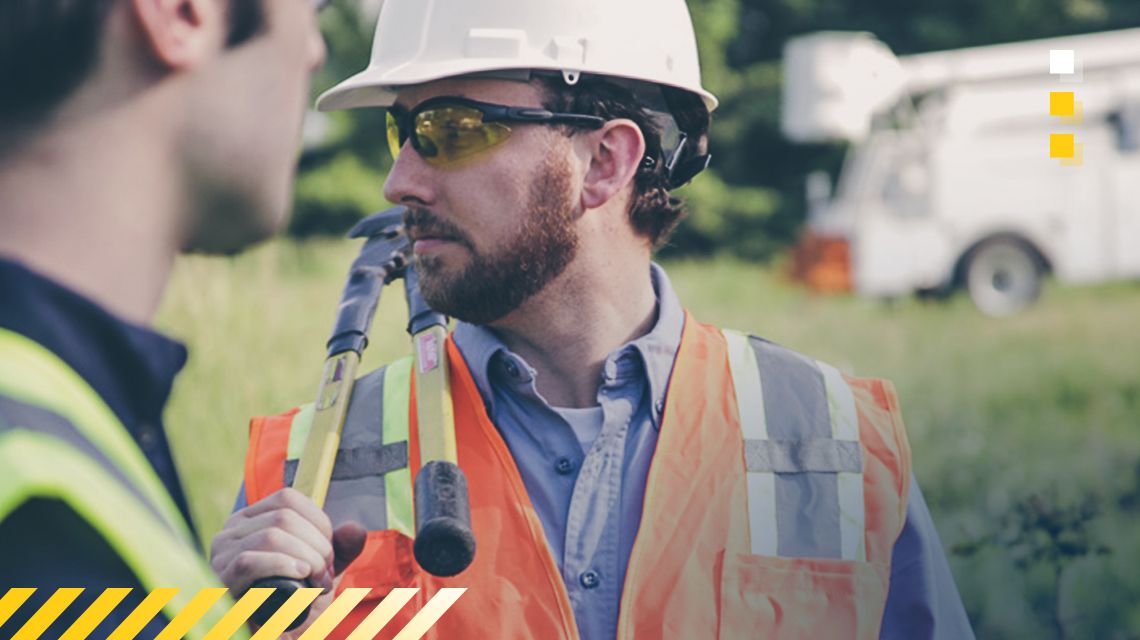 Operator standing outside with safety glasses and hard hat