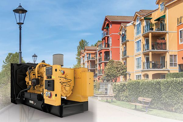 Apartment complex with Cat DG400 in foreground