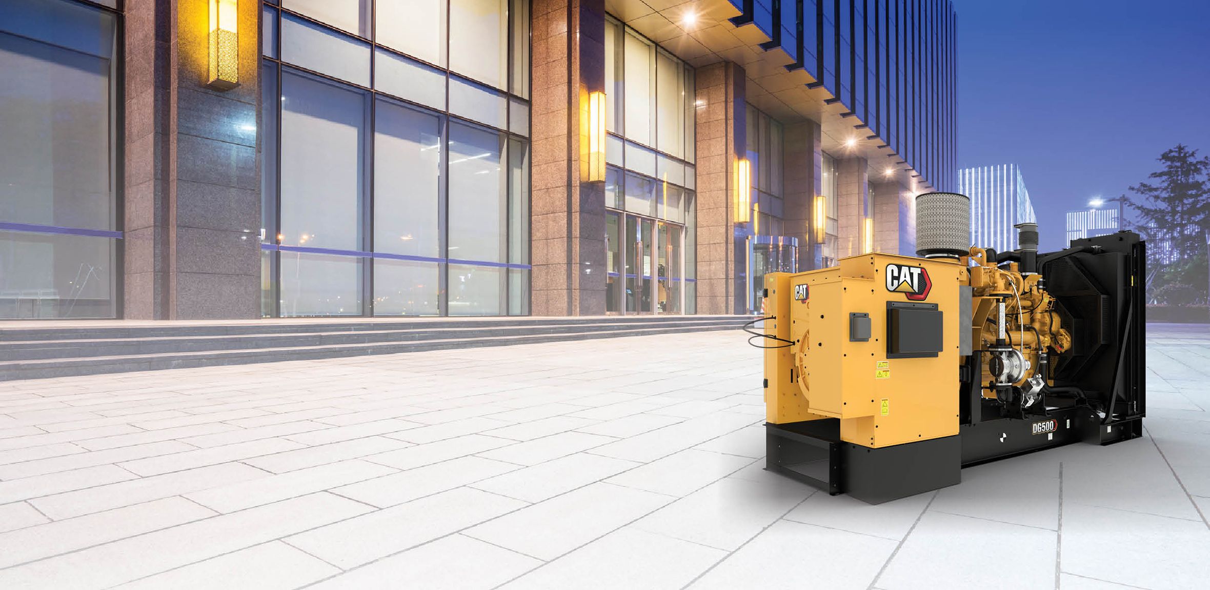 DG350-DG500 natural gas generator with commercial building in the background