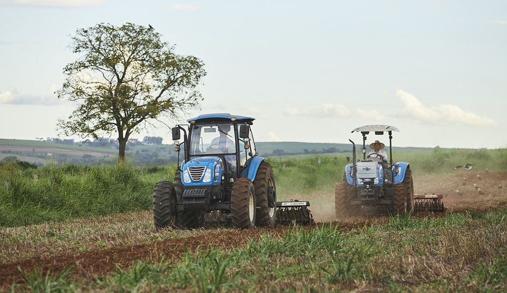 LS tractors ploughing field Image 3