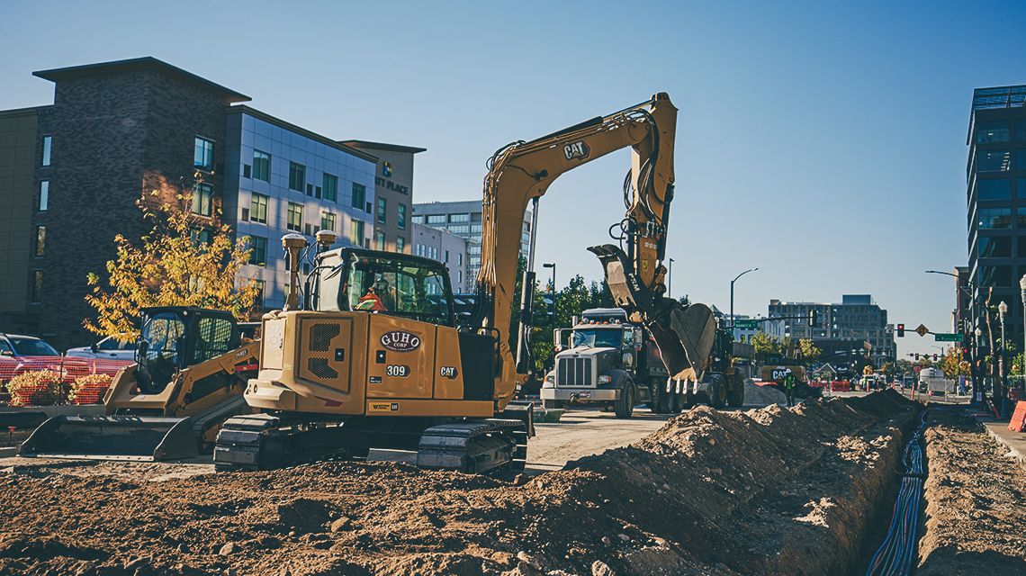 Excavator working on an urban jobsite - Whole-Fleet Capability